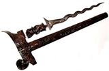 Lot 53: Antique Indonesian kris dagger with 14" Damascus blade, carved Foo dog
jeweled handle and ornately carved scabbard, measuring 25.5" overall
est. $400.00-$600.00