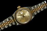 Lot 134: Rolex lady's 18K & stainless DateJust Quickset ref. 69173
watch with sapphire crystal, champagne dial and 17 link bracelet
in like new condition, est. $2,000.00-$3,000.00