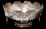Lot 121: FINE .950 sterling 2 handle repoussé hand chased center bowl
having lion motif handles, measuring 11" diameter x 5.75" high, weighing
1648 grams, illegible hallmark, marked .950 & tested, est. $1,700.00-$2,000.00