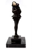 Lot 52: Art Deco Bronze and ivory face harlequin dancer figurine
measuring approx. 7.25" tall c. 1920-1930 est. $600.00 - $700.00