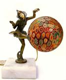 Lot 87: Art Deco millefiori 8.5" lamp featuring a metal harlequin
dancer with resin face balancing a millefiori lighted ball, mounted
on a marble base, c.1925-1935 est. $800.00-$1,200.00