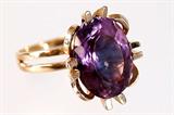 Lot 152: 14K vintage Estate amethyst ring featuring an oval faceted
amethyst approx. 10 carats, the ring weighing 8.12 grams
est. $250.00-$350.00