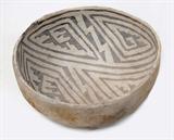 Lot 74: Anasazi Flagstaff black on white pottery bowl measuring 3.75" x 6.75"
in fine condition, having one edge loss (see photo) est. $400.00-$600.00