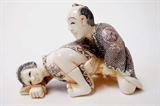 Lot 39: Japanese erotic ivory carving depicting an amorous
anatomically correct couple, having polychrome scrimshaw
measuring 3" long x 2" tall, artist signed, est. $250.00-$350.00