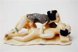 Lot 56: Japanese erotic ivory carving depicting an amorous
anatomically correct couple, measuring 3.125" long x 1.5"
tall, having polychrome scrimshaw, artist signed,
est. $200.00-$300.00
