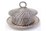 Lot 50: Robert Hennell III sterling repoussé 3 pc. lidded butter dish
measuring 5" tall to the finial x 6.5" wide at the lid x 7.5" at the
underplate weighing 843.1 grams, c.1850 est. $700.00-$900.00