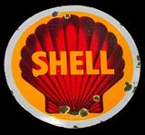 Lot 142: Scarce Porcelain Shell curb sign, measuring approx. 30"
diameter weighing approx. 20 lbs, having normal losses to one side
of the porcelain and greater losses to the other from age and use
c.1940-1950 est.$200.00-$400.00