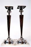Lot 129: Pair of sterling 12" candlesticks (non-weighted) purchased
by the consignor's estate in 1926, having scroll designs about
each side with one having an area for engraving, weighing 436 grams
excellent condition, est. $300.00-$400.00