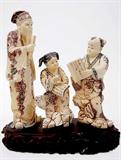 Lot 98: Superb Japanese carved ivory okimono figural group depicting
a scholar conducting a class, having polychrome scrimshaw, measuring
9.5" tall x 8.5" wide at the widest point, artist signed, excellent condition,
est. $1,400.00-$1,800.00