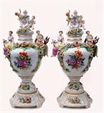 Lot 119: FINE pair of Von Schierholtz 24" porcelain hand painted 3 pc. lidded
urns adorned with Putti, maidens and applied florals and leaves, the bases
allowing each urn to be turned independently, excellent overall condition,
several normal losses to some flower edges, est. $1,000.00-$1,500.00