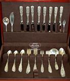 Lot 65: Westmoreland sterling service for 8 in the Milburn Rose 1940,
pattern consisting of 16 teaspoons, 8 dinner knives, 8 dinner forks,
8 salad forks, 4 serving spoons, 1 ladle, 1 berry spoon, 1 cocktail
fork and 1 master butter, weighing 1639.9 grams, est. $1,500.00-$2,000.00