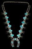 Lot 53: Vintage Navajo sterling turquoise 29" necklace with 12 blossoms
and a horseshoe naja, weighing 206.1 grams, consignor's estate
purchased in the 1940's directly from the maker, artist signed "G.G."
est. $300.00-$400.00