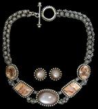 Lot 46: Steven Dweck original 16" necklace and clip-on earrings suite,
the necklace set with matched rutilated quartz, picture agate and large
moonstone, the set retailed at $1,900.00 est. $400.00-$600.00