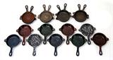 Lot 25: Lot of 17 Wagner mini frying pan skillets, all measuring approx. 6.5"
x 5", nine are enameled, 8 are plain cast iron, est. $200.00-$300.00