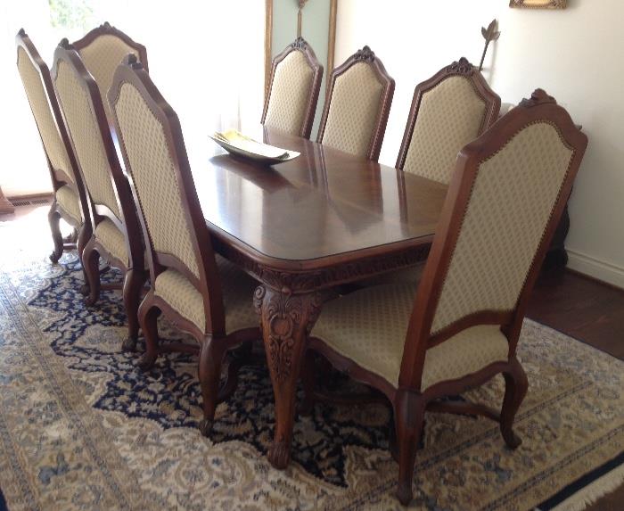 Henredon Table with 8 Side Chairs and 2 Arm Chairs (not pictured).  99" long as shown x 47" wide x 29" high -  plus an extra 20" leaf.  Also Shown:  9' x 12' Persian Nain Rug