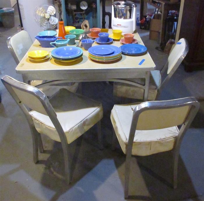Very Cool! This is an AWESOME- Mid Century stainless table (formica top) with arch styling and 4 stainless chairs. For interior design today this is so very hip. This set will be sold by highest bid over $300.00.
