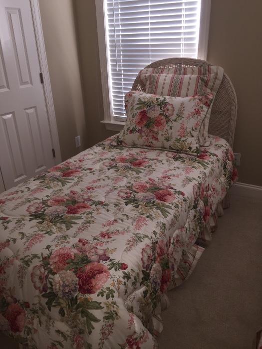 Pair of twin beds with wicker headboards, matching dresser with mirror