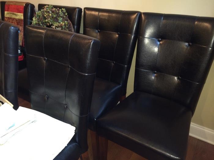 Six contemporary dining chairs (bonded leather, I think)