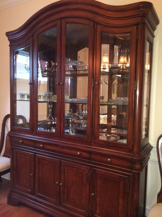 Contemporary traditional dining table, six chairs, lighted china cabinet