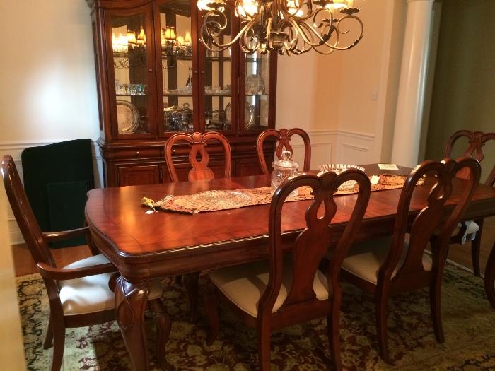 Contemporary traditional dining table, six chairs, lighted china cabinet