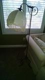 Iron floor lamp with fringed shade