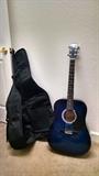 Blue guitar with nylon case