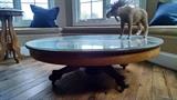 Modified antique coffee table with glass top