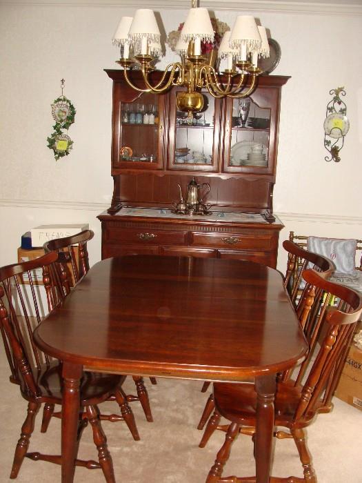 Dining Table with leaves and pads plus 6 matching Windsor style chairs