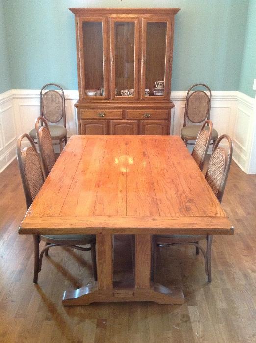 Polished Oak Farm Table w/ Two Leaves and Six Cane Back Upholstered Seat Dining Side Chairs