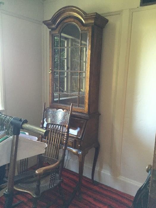 Glass front secretary and antique rocking chair