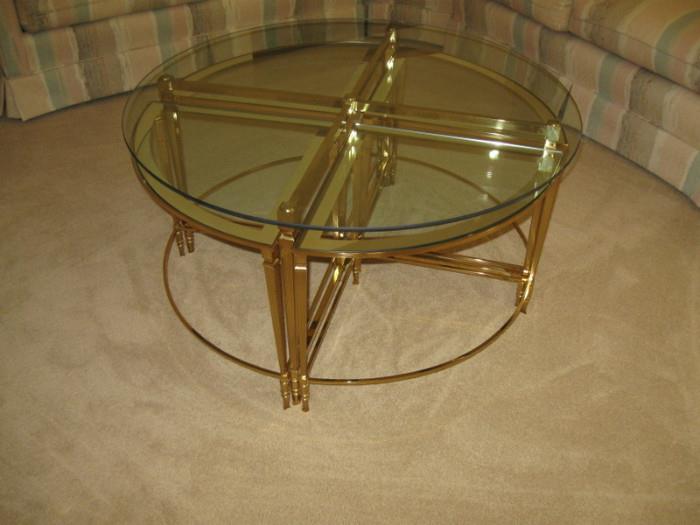 Glass coffee table with 4 sm nesting tables that fit underneath, 38 inches round, 19. 1/2 high-$80.00