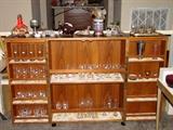 Folding bar cabinet with a lot of different barware