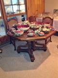 Octagonal wooden table with 4 cane back upholstered chairs