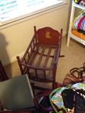 Small red doll cradle with kitty stencil