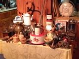Table full of small primitives and collectibles