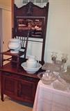 Old oak washstand with mirror and towel rack Child's cane bottom chair Bowl and pitcher set and pottery