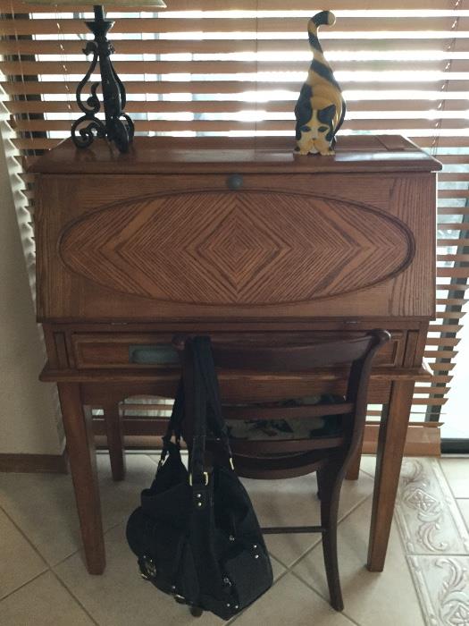 Beautiful antique secretary with dove drawers.  The wood as you can see makes a statement and like everything in this house, has been taken care of over the years. $150