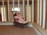 porcelan doll with pram