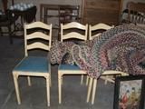 4 plain jane chairs with braided rugs.