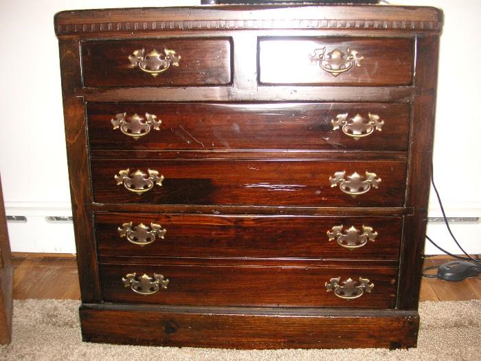 Dark pine chest, four drawer  31h x 31w 19d