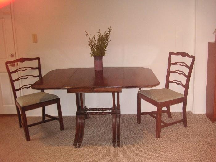 Antique  mahogany  drop-leaf table/3 leaves,  three mahogany side chairs, one arm chair 