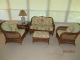 Dark Wicker Loveseat, Footstool, and Pair of Chairs, Table and Lamp