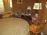 Rocker, End Table with Lamp, Rattan Glass top Table and Chairs, Rug 15x10
