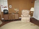 Record Player, Upholstered Recliner Chair, TV, End Table & Lamp