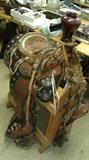 Tooled leather show horse saddle.