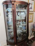 Mahogany curved glass curio cabinet