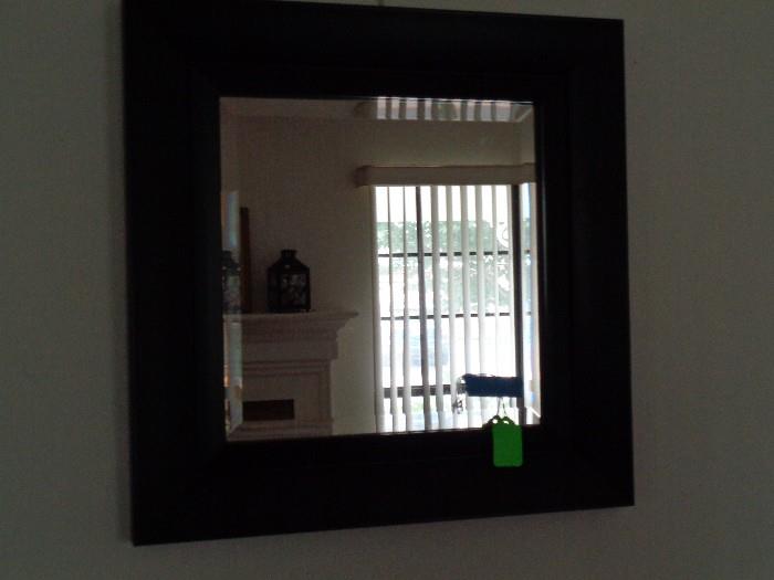 Beveled mirror in black frame