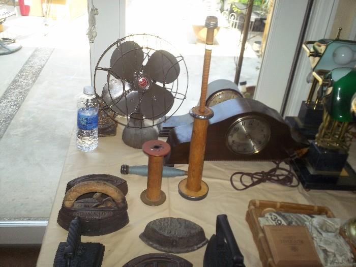 antiques fan,clocks,lamps,irons & spools 