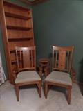 two captain chairs & bookshef