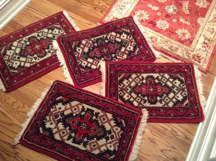 4 small Middle Eastern rugs